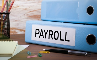 Time-consuming Payroll binders representing need for Payroll Services for a Small Business in Billings, Montana