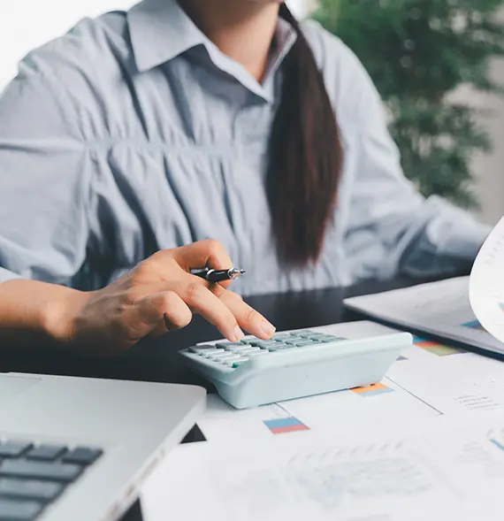 Business accountant reviewing financial data for a Small business, representing Accounting Services in Billings